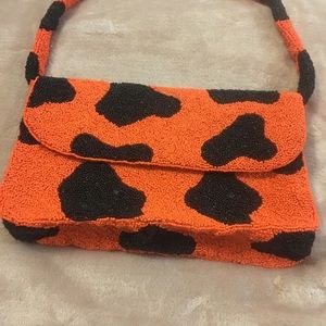 Orange and black hand bag